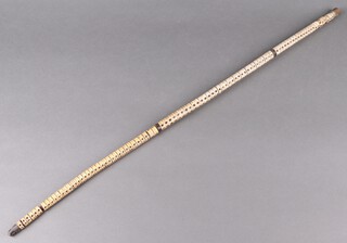 A walking stick formed from a fishes vertebrae 88cm long 