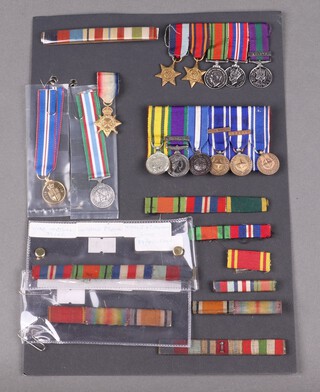 A group of 5 miniature medals comprising 1939-45 star, Burma star, Defence medal, British war Medal, General Service Medal 1918-1962, another group of 6 miniature medals comprising Queens Volunteer Reserve Medal, General Service medal 1962 and 4 UN medals, Cyprus, former Yugoslavia, Kosovo and 1 other together with various other miniatures, ribbons etc