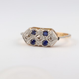 An 18ct yellow gold ring set 4 sapphires supported by diamonds, size Q, 3.9 grams 