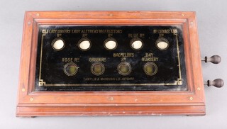 A 9 aperture servant's bell indicator  board - Lady Doreen's Room, Lady Anthea's Room, Miss Ruston's Room, Mr Dennis's Room, Rose Room, Green Room, Batchelor's Room and Day Nursery, by Tamplin Makovski 46cm x 26cm 