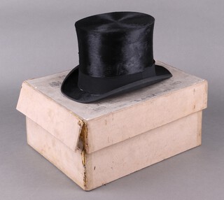 Henry Heath, a gentleman's black top hat, together with a Robert Heath hat box, size 6 7/8 