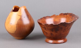 A turned yew vase the base marked Tim Spencer 99/22 15cm and a turned wooden bowl the base marked Alan Dreaver Blackboys 16cm 