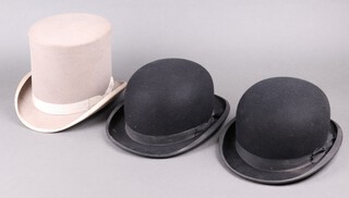 Christie London, a grey top hat size 7 1/8th (some stains in places), 2 black bowler hats by Lock & Co. both size 7 1/2, (slight tear to rim of 1, the other with dust marks and stains to the interior) 