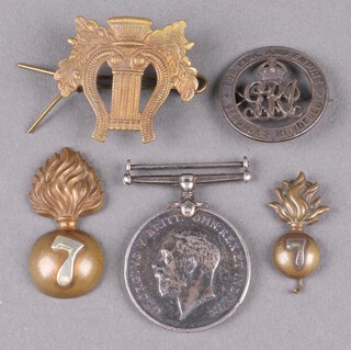 A British War medal to K.5354 W H Newick, Leading Stoker Royal Navy together with a First World War discharge badge no.13624, a Bandsman's badge, a Fusiliers cap badge and a do. collar dog 