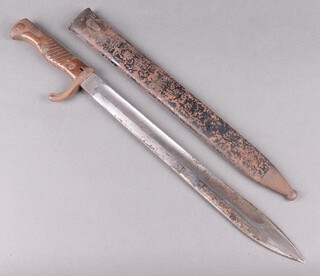 A Mauser bayonet, the blade marked Mauser A.G Obenrndort a M, the back of the bayonet marked with a crowned W and 15