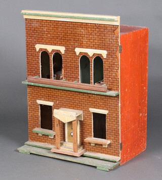 A Victorian dolls house in the form of a double fronted house containing a small collection of furniture 73cm h x 54cm w x 34cm d 