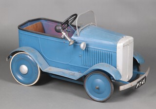 A Triang child's pressed metal pedal car in the form of a Daimler, with opening side door, windscreen, disc wheels with rubber tyres, 50cm h x 90cm l x 51cm w 