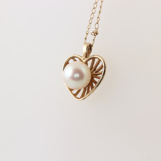A yellow gold chain marked 14k with pearl set pendant, gross weight 1.9 grams