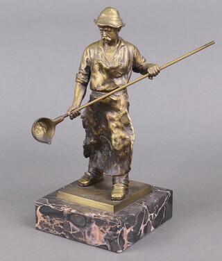 A gilt spelter figure of a foundry man, raised on a marble base 32cm 
