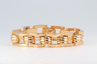 A yellow gold, testing as 22ct, ribbed and triangular link bracelet, 30.4 grams, 20cm 