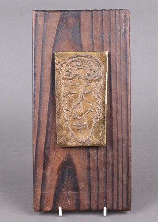 Xavier Corbero Olivella, 1935-2017, a bronze portrait plaque 14cm x 8cm, raised on a weathered pine panel 30cm x 15cm