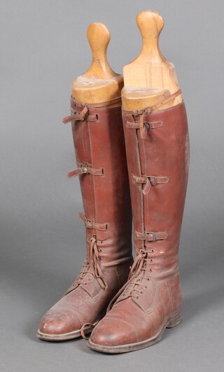 A pair of brown leather boots, approx. size 7, complete with wooden trees