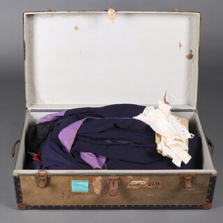 The Judicial robes of Judge John Lionel Clay ( 1918 - 2008 ), comprising 2 lawyers bags, pair of court shoes, 2 frock coats, waistcoat, gloves, 3 coloured belts, academic hood, 3 gowns (1 with moth) and various tabs, all contained in a cabin trunk 
