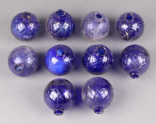 Ten 19th Century moulded glass fire grenades in cobalt blue, each 7cm diam