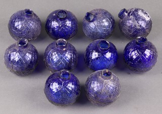 Ten 19th Century moulded glass fire grenades in cobalt blue, each 7cm diam 
