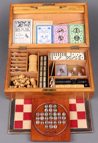 An Edwardian games compendium comprising St Georges pattern chess set (1 black rook has damage to castellation, 2 knights possibly glued, 1 possible replacement pawn, 1 pawn with split to head, 1 pawn with pitting to body, 1 white knight has been glued, King has split to crown), 6 lead horses (3 with broken legs), 18 black and white turned drafts, a standard double six set of dominoes, 6 dice and a die thrower, square solitaire board with 30 clear glass marbles and 26 assorted marbles, 2 Bezique markers, 2 other markers, bone and wooden cribbage board, double sided games board with chess, Backgammon and The Steeplechase game, instructions for Canasta, dominoes, crib and Rooks Game of Games, together with 2 complete sets of Fred Piatnik playing cards, all contained in a bleached mahogany box with hinged lid 10cm h x 33cm w x 20cm d 