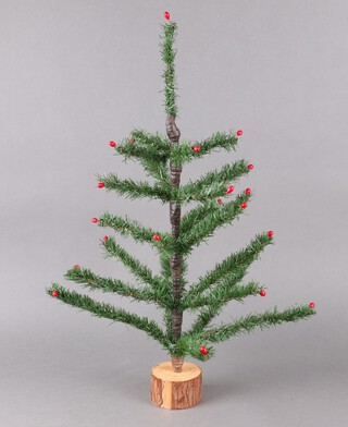 A mid 20th Century Woolworths artificial Christmas tree on a circular wooden base 66cm h 