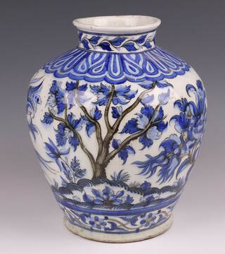 An 18th/19th Century Isnic Pottery blue and white vase with floral decoration 29cm 