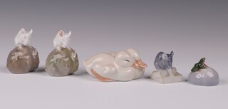 A collection of Erik Nielsen for Royal Copenhagen figures  - seated duck no. 64  6cm, 2 mice sitting on a rock no. 511 5cm, mouse with cheese no. 510 4cm and a frog on rock 3cm 
