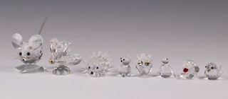 A Swarovski Crystal figure of a mouse 4cm, ditto butterfly 5cm, hedgehog 5cm, 5 miniature figures of a bird, penguin, owl, clam, cat and bird 4cm together with a glass stand and 3 mirrored bases 