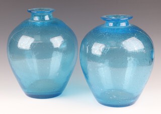 A near pair of blue bubble glass vases 30cm x and 29cm 