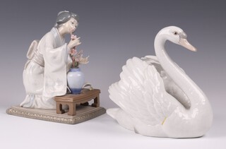A Lladro figure of a swan 5231 18cm and ditto Japanese lady arranging flowers J-4E 18cm 