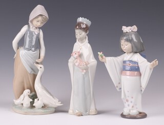Three Lladro figures - Feeding Ducks 1277 23cm, King Balthazar 8cm and Flower Gazer 6152 18cm (thumb missing) 