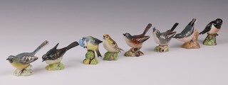 Eight Beswick figures of birds - Grey Wagtail 1041, Nut Hatch 48, Gold Crest 2415, Blue Tit 992, Stonechat 2274, Wren, Whitethroat 2106 and 1 other 