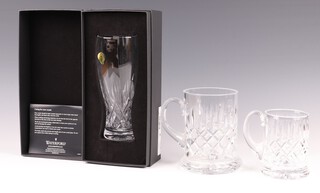A Waterford Crystal pint glass boxed, a cut glass pint tankard and a cut glass half pint tankard 