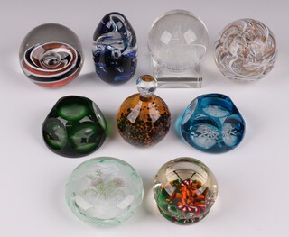 Nine cut glass paperweights - green faceted decorated a fish, blue faceted decorated a ships wheel, a Selkirk glass butterfly no.15/200 1980, a Tweedsmuir decorated a thistle, a Selkirk Mimbus 1987, a Langham swirl glass, a Murano spotted glass paperweight, an etched glass 3 dimensional decorated The Kremlin and an unmarked blue glass paperweight 