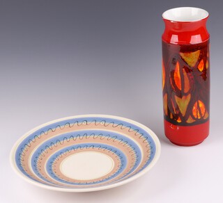 A Poole Pottery Atomic orange vase, the base marked Poole England 93, 31cm together with a Poole Pottery charger 920 32cm 