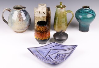 A cylindrical black Art Pottery jar and cover incised TA 7cm, a brown glazed Art Pottery vase, do. dish, do. blue glazed vase, coffee pot and jug  