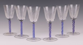 A set of 6 19th Century trumpet shaped wine glasses with etched vinous decoration, the stems with blue air twist stems 