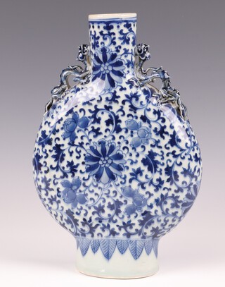 A 19th Century blue and white twin handled moon flask with dragon handles 26cm 