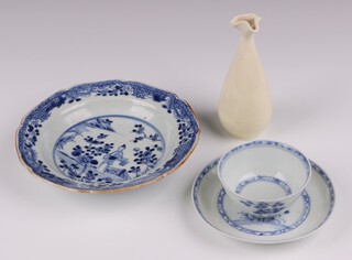 A Nankin Cargo blue and white tea bowl and saucer, the base with Christie's labels, a shaped blanc de chine porcelain vase 12cm and a Japanese blue and white bowl decorated a standing figure 16cm (crack and chipped) 