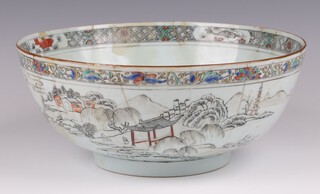 A Chinese circular Qianlong period porcelain bowl, the interior decorated a carp, the exterior decorated pagodas and mountains 23cm (extensively damaged and restored) 