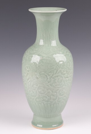 A late 19th Century Chinese Celadon club shaped vase, the base with 6 character mark 33cm 