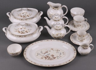 A Royal Doulton Mandalay pattern 93 piece dinner/tea service comprising 2 oval twin handled tureens and covers, oval meat plate, 9 dinner plates, 2 large side plates, 15 side plates, 9 tea plates, 13 dessert bowls (7 seconds), small bowl, large jug, 2 pairs of jugs, 2 teapots, twin handled plate, 10 tea cups (1 cracked), 9 saucers, 4 coffee cans, 4 saucers, large sugar bowl, 3 small sugar bowls, sauce boat stand (second) 