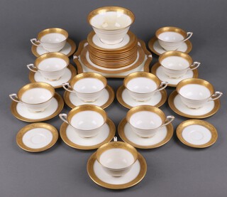 A 39 piece Royal Worcester tea service, the base with blue Worcester mark, 1393, 1 star and 3 dots, comprising twin handled plate, sugar bowl (cracked), circular bread plate (crazed), 11 tea plates, 11 cups (2 cups cracked), 12 saucers,  2 small saucers