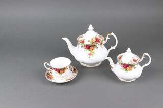 A Royal Albert Old Country Rose pattern 76 piece tea/dinner service comprising 6 dinner plates (all seconds, 1 with chip to base), 6 side plates (2 seconds), 6 large tea plates (all seconds), 5 small tea plates, 6 dessert bowls (4 seconds), 13 cups (1 a second and with chip to base), 14 saucers, breakfast cup and 2 saucers  (all seconds), mug, sauce boat and stand, salt and pepper, twin handled bread plate, bowl (second), large teapot (second), medium teapot (second), 2 small teapots, 2 cream jugs, lidded sugar bowl (second), teapot lid, rectangular bread plate (second), heart shaped plated, 6 coasters boxed, together with a similar vase in the form of a boot, similar sauce boat and a Royal Albert Peppermint Damask cup and saucer 