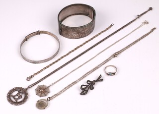 An engraved silver bangle, an engraved silver bracelet, a flat link silver bracelet 18cm, a silver pendant in the form of a spider's web hung on a fine silver chain and other items of silver jewellery, 58.2 grams gross and 1 other chain and pendant  