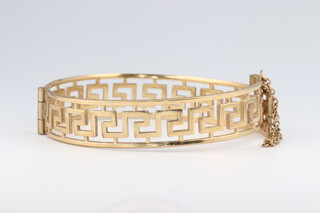 A yellow gold, testing as 14ct, pierced gold bracelet with Grecian key decoration, 14.5 grams 