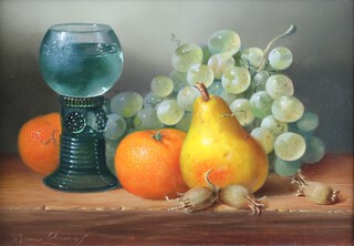 **Brian Davies (British, 1942-2014), Still Life with Goblet, Grapes, Pear and Oranges, oil on board, signed, 17cm x 24cm, within a gilt composition frame. **Please note Artists Resale Rights may be payable upon this lot
