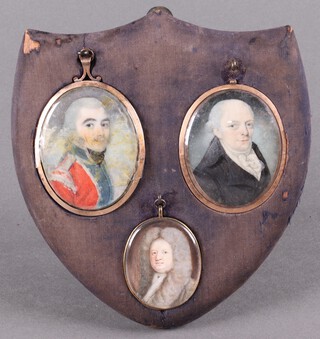 Circle of Richard Cosway, Oval Miniature Portrait of a Gentleman wearing Army Uniform, early 19th century watercolour on ivory, within a metal frame, the reverse inset with a glass panel of woven hair 7.5cm x 5cm, together with an 18th century portrait miniature of a gentleman and a 19th century portrait miniature of a gentleman, all mounted on a shield form display stand.