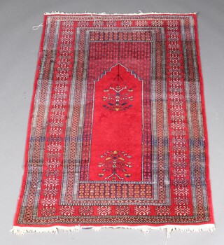 A red and blue ground Belouche rug with mihrab and mosque lamp to the centre within a multi row border 157cm x 94cm 