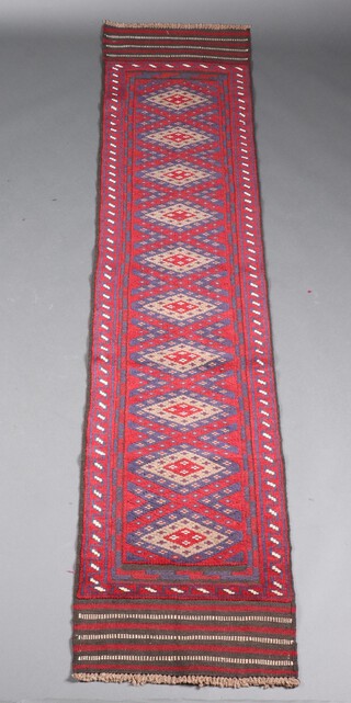 A red and blue ground Meshwani runner with 10 octagons to the centre 270cm x 57cm 