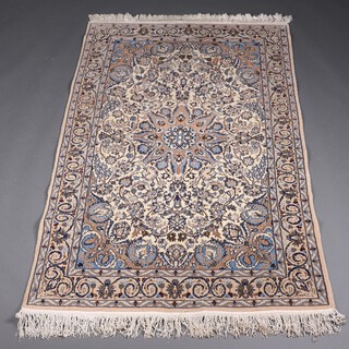A white and blue ground North Persian rug with central medallion within a 3 row border 211cm x 125cm  