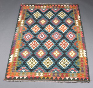 A green, tan and black ground Maimana Kilim rug with overall diamond design 193cm x 125cm