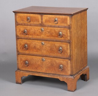 A Queen Anne style quarter veneered and crossbanded figured walnut chest of 2 short and 3 long drawers, raised on bracket feet 78cm h x 67cm w x 41cm d 