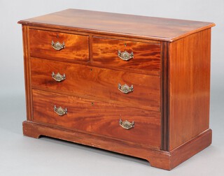 An Edwardian walnut chest of 2 short and 2 long drawers with brass plated drop handles, raised on a platform base 73cm h x 106cm w x 50cm d 
